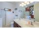 Bathroom featuring double sinks, a walk-in shower, and neutral decor for a clean and functional space at 42297 W Lunar St, Maricopa, AZ 85138