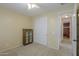 Bedroom with carpeted floors, a ceiling fan, and a sliding-door closet; neutral colors throughout at 42297 W Lunar St, Maricopa, AZ 85138