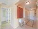 Bright hallway featuring neutral colors and tile flooring, providing a welcoming entrance to the home at 42297 W Lunar St, Maricopa, AZ 85138