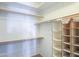 Spacious walk-in closet with ample shelving and hanging space for organized storage at 42297 W Lunar St, Maricopa, AZ 85138