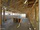 Exposed beams of a home under construction with a concrete foundation and visible framework at 4262 E Brook Lynn Pl, San Tan Valley, AZ 85140