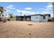 A serene backyard featuring desert landscaping, a charming patio area, and ample space for relaxation and outdoor activities at 443 W Mulberry Dr, Phoenix, AZ 85013