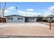 Charming single-story home with a well-maintained yard, a carport, and a stylish desert landscape at 443 W Mulberry Dr, Phoenix, AZ 85013