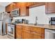 Close up of this kitchen shows granite countertops and stainless steel appliances at 443 W Mulberry Dr, Phoenix, AZ 85013