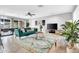 Bright and spacious living room with stylish furniture, a ceiling fan, and seamlessly connected dining area at 443 W Mulberry Dr, Phoenix, AZ 85013