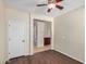 Bedroom with door and view into hall with wood-look floors, neutral walls, and white trim at 4602 E Firestone Dr, Chandler, AZ 85249