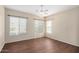 Bright bedroom with neutral walls and hardwood floors featuring lots of natural light at 4602 E Firestone Dr, Chandler, AZ 85249