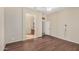 Bedroom features hardwood floors and a view to the ensuite bathroom at 4602 E Firestone Dr, Chandler, AZ 85249