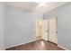 Bedroom with wood-look floors, light blue walls, and closet with sliding doors at 4602 E Firestone Dr, Chandler, AZ 85249