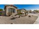 Exterior view of a home with desert landscaping, showcasing a two-car garage and a clean, modern design at 4602 E Firestone Dr, Chandler, AZ 85249