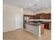 Kitchen boasts stainless steel appliances, granite counters, and kitchen island at 4602 E Firestone Dr, Chandler, AZ 85249