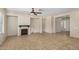 Spacious living room featuring a fireplace, neutral paint, tile floors and a ceiling fan at 4602 E Firestone Dr, Chandler, AZ 85249