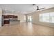 Open floorplan with a view of the kitchen, a sliding door to the backyard, and a ceiling fan at 4602 E Firestone Dr, Chandler, AZ 85249