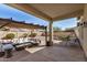 Relaxing covered patio area with lounge seating, dining area, and garden at 4602 E Firestone Dr, Chandler, AZ 85249