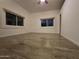 The bedroom has hardwood floors, two windows, and neutral paint at 46312 N 38Th Ave, New River, AZ 85087