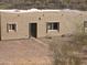 Close-up of the exterior detail with windows and a simple walkway to the door at 46312 N 38Th Ave, New River, AZ 85087