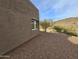 Exterior view capturing the side of the home with desert landscape and blue sky at 46312 N 38Th Ave, New River, AZ 85087