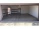 Clean, empty garage with space for storage and parking at 4927 W Golden Ln, Glendale, AZ 85302