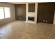 Spacious living room features tile floors and decorative brick fireplace at 4927 W Golden Ln, Glendale, AZ 85302