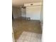 Bright living room with tile flooring, a ceiling fan, and sliding glass doors at 4927 W Golden Ln, Glendale, AZ 85302