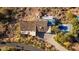 Aerial view of a house with a pool and scenic mountain terrain at 4959 E Red Rock Dr, Phoenix, AZ 85018