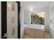 Bathroom with a soaking tub offering scenic views at 4959 E Red Rock Dr, Phoenix, AZ 85018