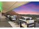 Expansive covered deck with stylish furniture, perfect for enjoying city views at 4959 E Red Rock Dr, Phoenix, AZ 85018