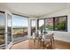 Dining area with glass table, mountain views, and access to a large outdoor balcony at 4959 E Red Rock Dr, Phoenix, AZ 85018