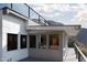 Exterior view of a modern style home with a deck, railings, and mountain views at 4959 E Red Rock Dr, Phoenix, AZ 85018