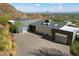 Modern home exterior with desert landscaping and mountain views in the background at 4959 E Red Rock Dr, Phoenix, AZ 85018