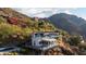 Exterior view of a home on a mountainside with a pool and decks at 4959 E Red Rock Dr, Phoenix, AZ 85018