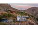 Expansive home on a mountainside with a pool and incredible views at 4959 E Red Rock Dr, Phoenix, AZ 85018