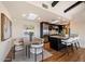 Open kitchen and dining area featuring skylights, stainless appliances, and hardwood floors at 4959 E Red Rock Dr, Phoenix, AZ 85018