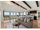 Bright living room with large windows that shows city views, open to dining and kitchen areas at 4959 E Red Rock Dr, Phoenix, AZ 85018