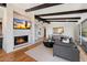 Inviting living room with fireplace, hardwood floors, comfortable seating, and stylish decor at 4959 E Red Rock Dr, Phoenix, AZ 85018