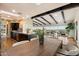 Open-concept living space showcasing hardwood floors, a kitchen island, and modern design at 4959 E Red Rock Dr, Phoenix, AZ 85018