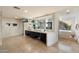Bright main bathroom features dual sinks, tile flooring, a bathtub, and a view at 4959 E Red Rock Dr, Phoenix, AZ 85018