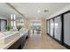 Large main bathroom features dual sinks, tile flooring, and access to a bedroom at 4959 E Red Rock Dr, Phoenix, AZ 85018
