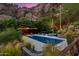 Backyard pool and lounge area with mountain views at 4959 E Red Rock Dr, Phoenix, AZ 85018