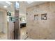 Elegant bathroom shower showcasing luxury fixtures and tiled niche at 4959 E Red Rock Dr, Phoenix, AZ 85018