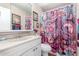 Bathroom with a patterned shower curtain and ample light at 5526 E Cicero St, Mesa, AZ 85205