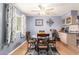 Cozy dining area with a ceiling fan, nice decor, and abundant natural light at 5526 E Cicero St, Mesa, AZ 85205