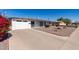 Charming single-story home with a well-maintained front yard and a two-car garage at 5526 E Cicero St, Mesa, AZ 85205