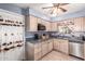 Functional kitchen with bright cabinets, modern appliances, and tile flooring at 5526 E Cicero St, Mesa, AZ 85205