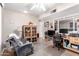 Inviting living room featuring a recliner, display cabinet, and ample lighting at 5526 E Cicero St, Mesa, AZ 85205