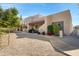 Inviting home with a tiled roof, covered porch, and well-manicured front yard at 5848 W Gelding Dr, Glendale, AZ 85306