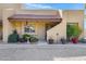 Charming home featuring a red tile roof, cozy front porch, and desert landscaping at 5848 W Gelding Dr, Glendale, AZ 85306