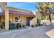 Charming single story townhome with a tiled roof and well-maintained landscaping at 5848 W Gelding Dr, Glendale, AZ 85306