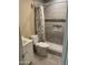 Updated bathroom with tiled shower and modern fixtures at 6617 W Peck Dr, Glendale, AZ 85301