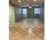 Open living room featuring tiled floors and a ceiling fan at 6617 W Peck Dr, Glendale, AZ 85301